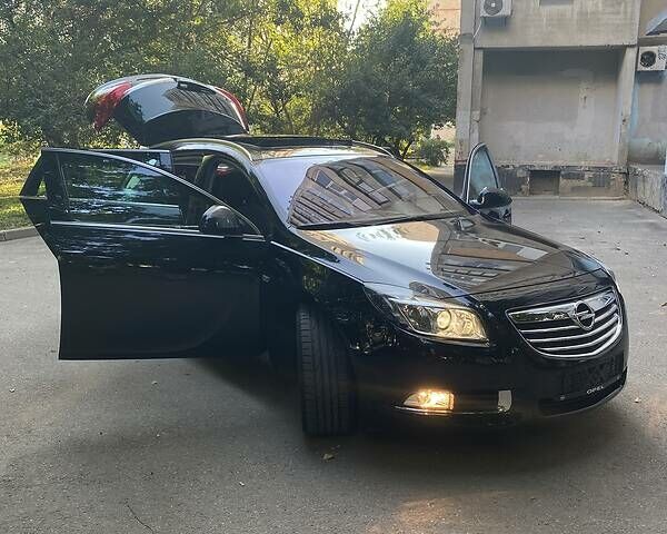 Черный Опель Insignia Sports Tourer, объемом двигателя 2 л и пробегом 173 тыс. км за 11450 $, фото 21 на Automoto.ua