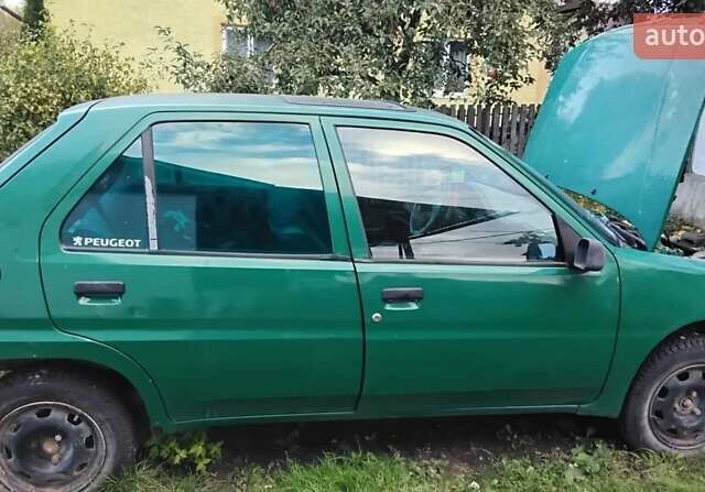 Зеленый Пежо 106, объемом двигателя 1.1 л и пробегом 317 тыс. км за 1200 $, фото 7 на Automoto.ua