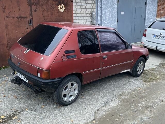 Красный Пежо 205, объемом двигателя 1.8 л и пробегом 200 тыс. км за 700 $, фото 1 на Automoto.ua
