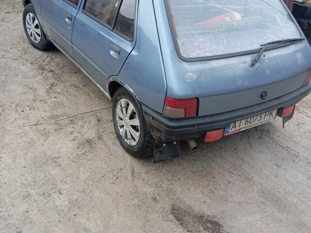 Серый Пежо 205, объемом двигателя 1.8 л и пробегом 250 тыс. км за 650 $, фото 2 на Automoto.ua