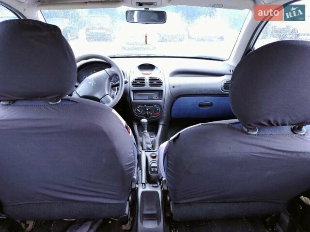 Білий Пежо 206, об'ємом двигуна 1.4 л та пробігом 182 тис. км за 4200 $, фото 2 на Automoto.ua