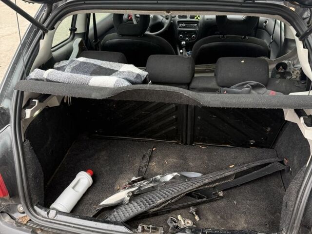 Черный Пежо 206, объемом двигателя 1.4 л и пробегом 240 тыс. км за 1200 $, фото 6 на Automoto.ua