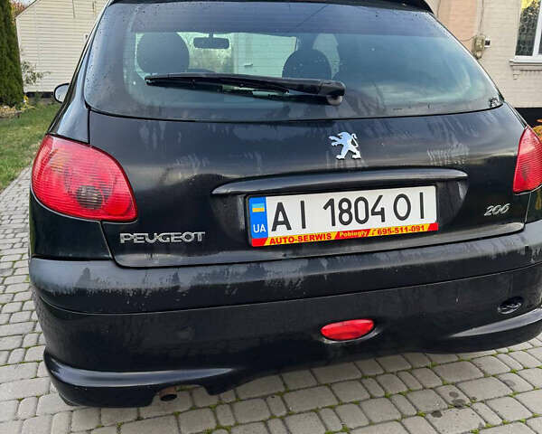 Черный Пежо 206, объемом двигателя 1.36 л и пробегом 142 тыс. км за 3500 $, фото 1 на Automoto.ua