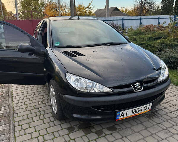 Черный Пежо 206, объемом двигателя 1.36 л и пробегом 142 тыс. км за 3500 $, фото 2 на Automoto.ua