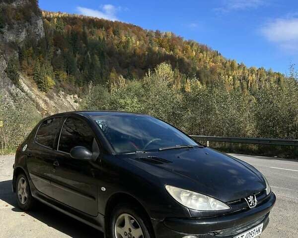 Черный Пежо 206, объемом двигателя 1.36 л и пробегом 355 тыс. км за 2300 $, фото 6 на Automoto.ua