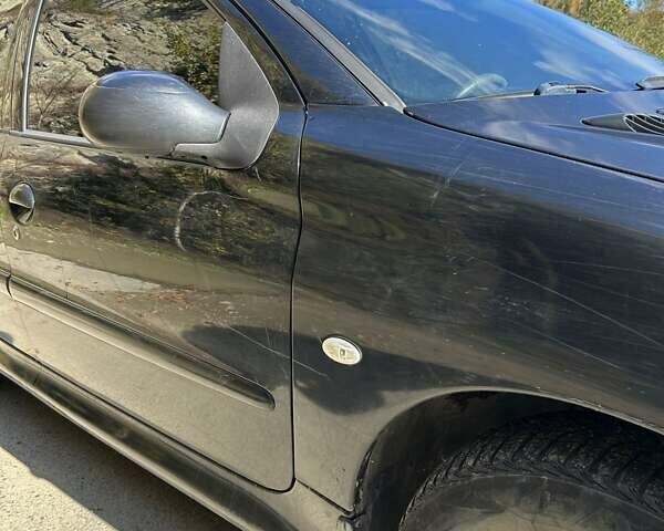 Черный Пежо 206, объемом двигателя 1.36 л и пробегом 355 тыс. км за 2650 $, фото 4 на Automoto.ua