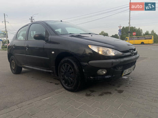 Черный Пежо 206, объемом двигателя 1.6 л и пробегом 231 тыс. км за 3700 $, фото 3 на Automoto.ua