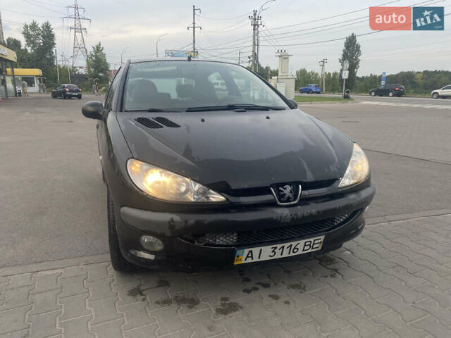 Черный Пежо 206, объемом двигателя 1.6 л и пробегом 231 тыс. км за 3700 $, фото 1 на Automoto.ua