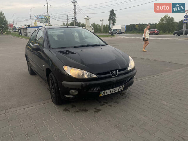 Черный Пежо 206, объемом двигателя 1.6 л и пробегом 231 тыс. км за 3700 $, фото 2 на Automoto.ua
