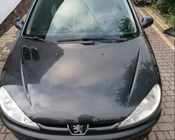 Чорний Пежо 206, об'ємом двигуна 1.4 л та пробігом 150 тис. км за 3000 $, фото 5 на Automoto.ua
