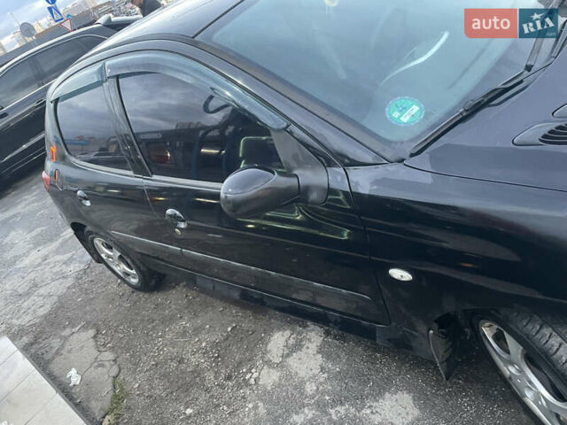 Черный Пежо 206, объемом двигателя 1.1 л и пробегом 335 тыс. км за 3200 $, фото 5 на Automoto.ua