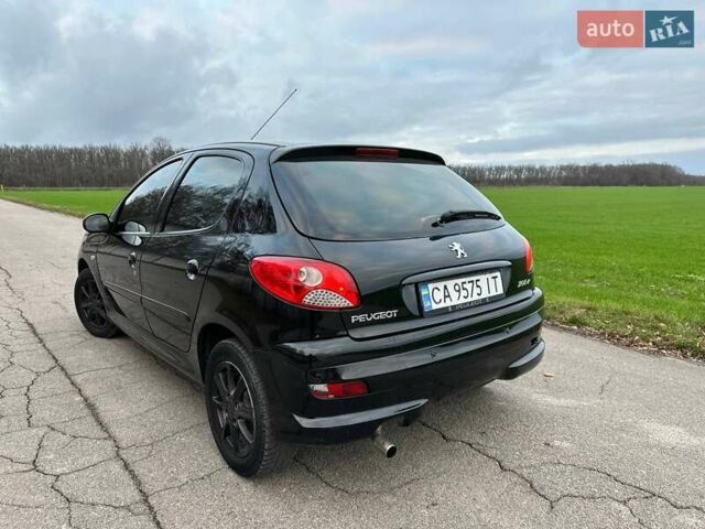 Чорний Пежо 206, об'ємом двигуна 1.4 л та пробігом 263 тис. км за 4300 $, фото 5 на Automoto.ua