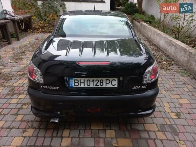 Черный Пежо 206, объемом двигателя 2 л и пробегом 238 тыс. км за 5000 $, фото 4 на Automoto.ua