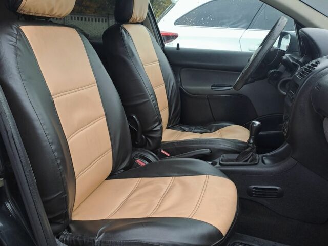 Черный Пежо 206, объемом двигателя 1.4 л и пробегом 406 тыс. км за 2000 $, фото 4 на Automoto.ua