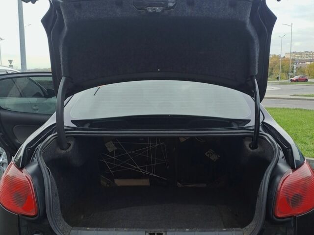 Черный Пежо 206, объемом двигателя 1.4 л и пробегом 406 тыс. км за 2000 $, фото 6 на Automoto.ua