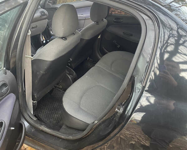 Черный Пежо 206, объемом двигателя 1.4 л и пробегом 148 тыс. км за 2100 $, фото 5 на Automoto.ua