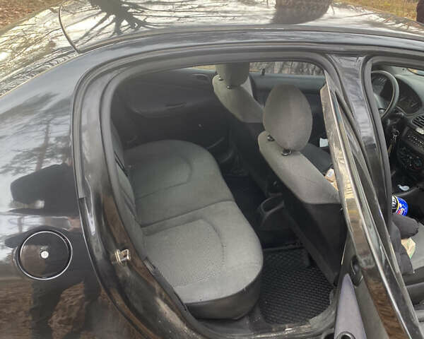 Черный Пежо 206, объемом двигателя 1.4 л и пробегом 148 тыс. км за 2100 $, фото 4 на Automoto.ua