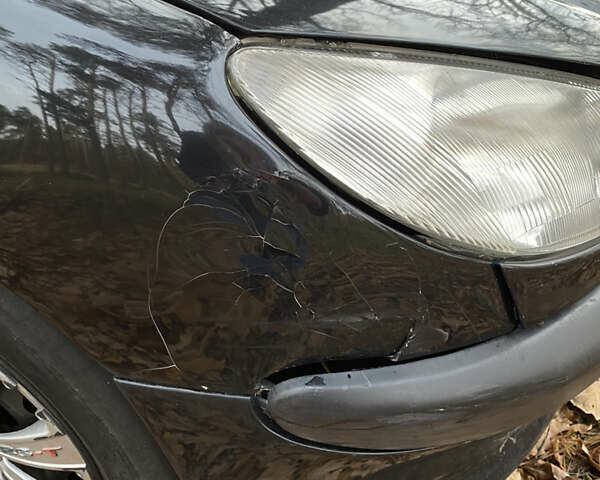 Черный Пежо 206, объемом двигателя 1.4 л и пробегом 148 тыс. км за 2100 $, фото 8 на Automoto.ua