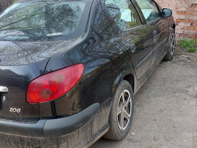 Черный Пежо 206, объемом двигателя 1.36 л и пробегом 107 тыс. км за 3900 $, фото 1 на Automoto.ua