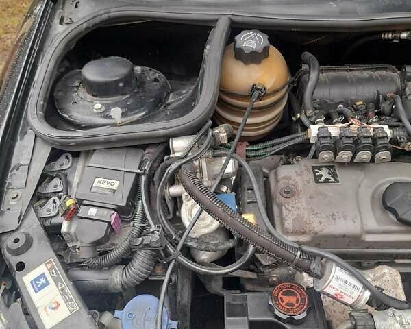 Черный Пежо 206, объемом двигателя 1.4 л и пробегом 286 тыс. км за 3160 $, фото 21 на Automoto.ua