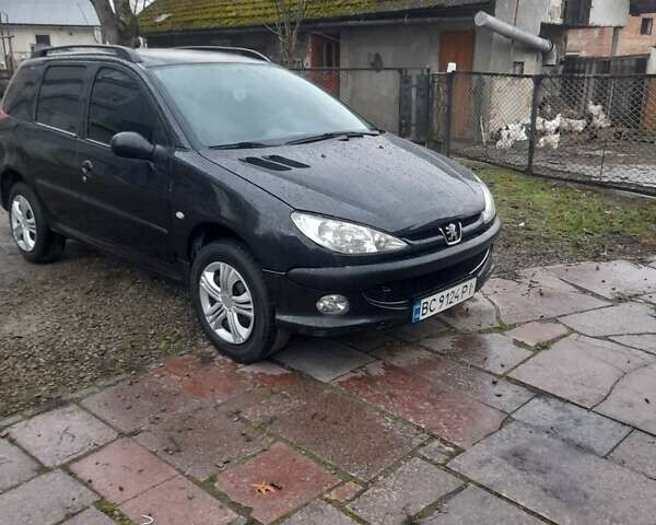 Черный Пежо 206, объемом двигателя 1.4 л и пробегом 298 тыс. км за 2896 $, фото 1 на Automoto.ua