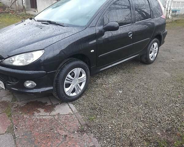Черный Пежо 206, объемом двигателя 1.4 л и пробегом 298 тыс. км за 2896 $, фото 2 на Automoto.ua