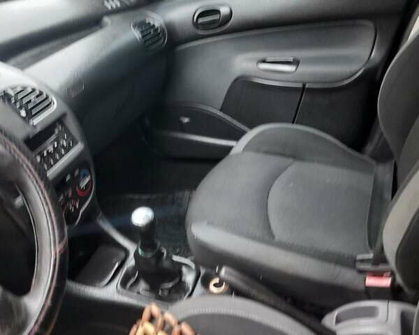 Черный Пежо 206, объемом двигателя 1.4 л и пробегом 298 тыс. км за 2896 $, фото 12 на Automoto.ua