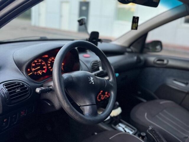 Красный Пежо 206, объемом двигателя 1.4 л и пробегом 236 тыс. км за 1900 $, фото 7 на Automoto.ua