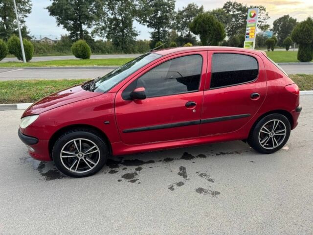 Красный Пежо 206, объемом двигателя 1.4 л и пробегом 236 тыс. км за 1900 $, фото 1 на Automoto.ua