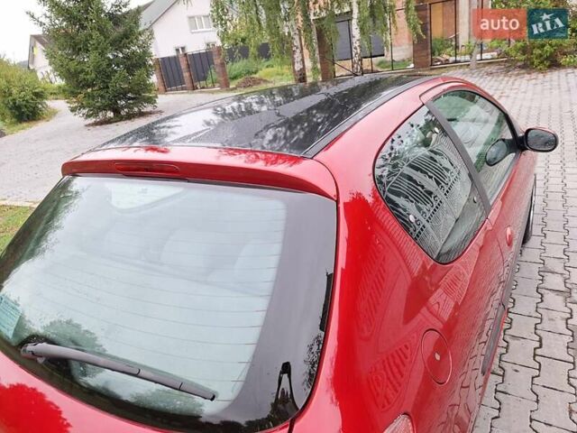 Красный Пежо 206, объемом двигателя 1.36 л и пробегом 230 тыс. км за 2200 $, фото 12 на Automoto.ua