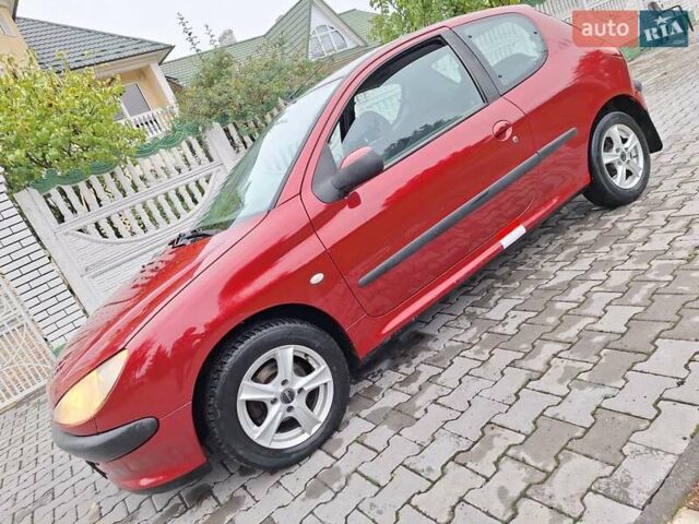 Красный Пежо 206, объемом двигателя 1.36 л и пробегом 230 тыс. км за 2200 $, фото 21 на Automoto.ua