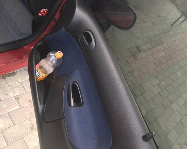 Красный Пежо 206, объемом двигателя 1.4 л и пробегом 270 тыс. км за 3350 $, фото 2 на Automoto.ua