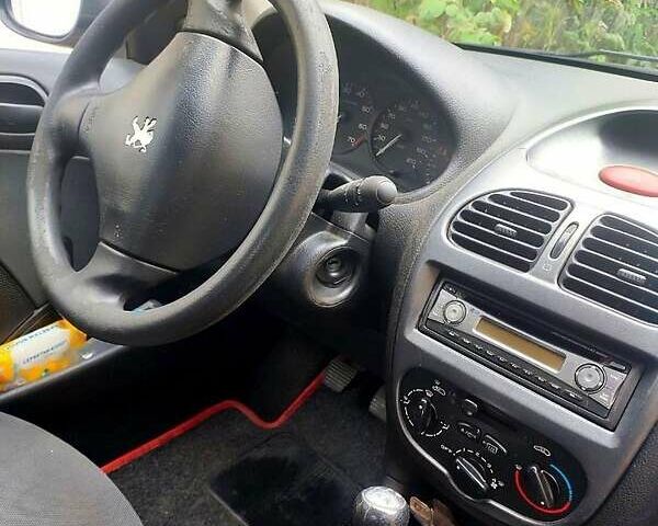 Красный Пежо 206, объемом двигателя 1.4 л и пробегом 211 тыс. км за 3000 $, фото 10 на Automoto.ua