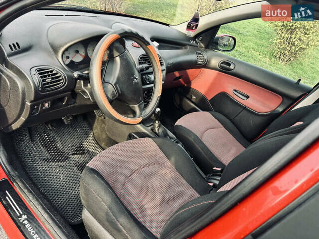 Красный Пежо 206, объемом двигателя 1.36 л и пробегом 241 тыс. км за 3200 $, фото 6 на Automoto.ua