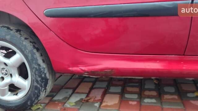 Червоний Пежо 206, об'ємом двигуна 1.4 л та пробігом 204 тис. км за 2850 $, фото 10 на Automoto.ua