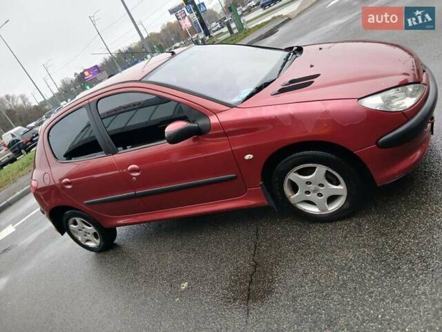 Красный Пежо 206, объемом двигателя 1.4 л и пробегом 231 тыс. км за 3400 $, фото 1 на Automoto.ua