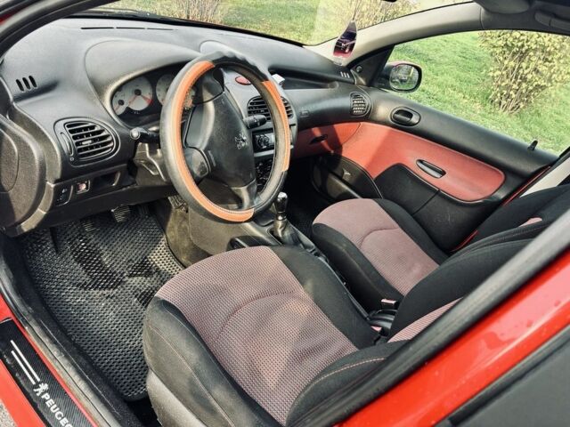 Красный Пежо 206, объемом двигателя 1.4 л и пробегом 241 тыс. км за 3200 $, фото 4 на Automoto.ua