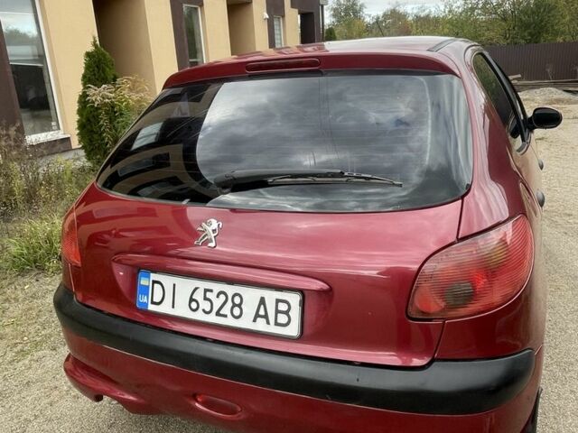 Красный Пежо 206, объемом двигателя 1.4 л и пробегом 182 тыс. км за 4000 $, фото 7 на Automoto.ua