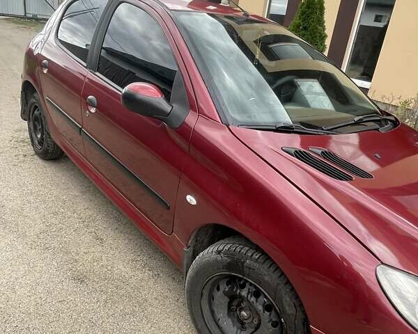 Красный Пежо 206, объемом двигателя 1.36 л и пробегом 181 тыс. км за 3900 $, фото 9 на Automoto.ua