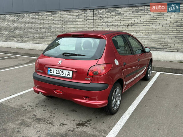 Красный Пежо 206, объемом двигателя 1.4 л и пробегом 76 тыс. км за 5200 $, фото 2 на Automoto.ua