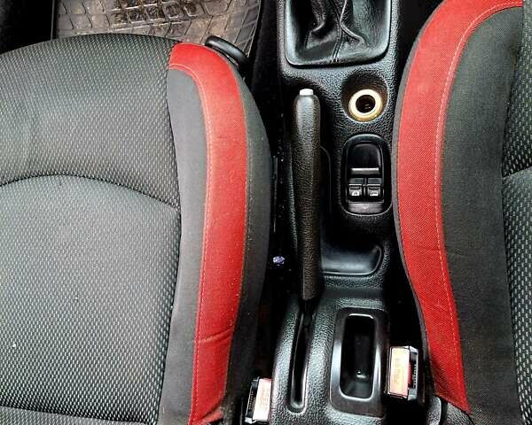 Красный Пежо 206, объемом двигателя 1.36 л и пробегом 226 тыс. км за 3799 $, фото 26 на Automoto.ua