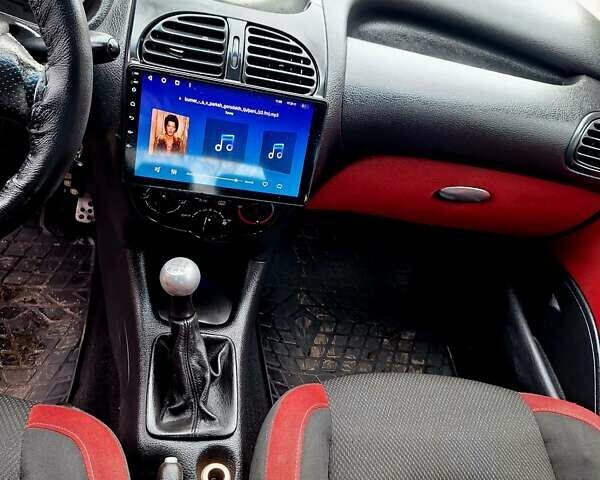 Красный Пежо 206, объемом двигателя 1.36 л и пробегом 226 тыс. км за 3799 $, фото 19 на Automoto.ua