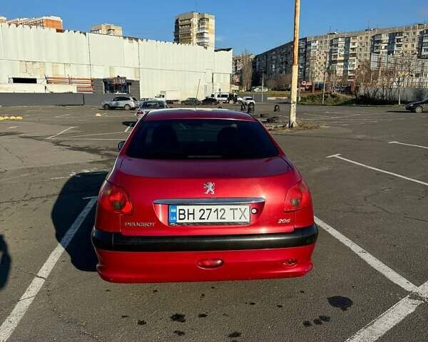 Красный Пежо 206, объемом двигателя 1.36 л и пробегом 177 тыс. км за 3200 $, фото 11 на Automoto.ua
