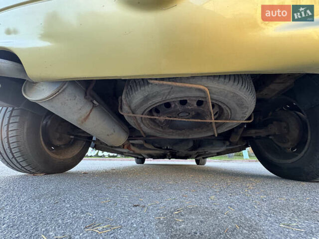 Желтый Пежо 206, объемом двигателя 1.12 л и пробегом 181 тыс. км за 2500 $, фото 11 на Automoto.ua