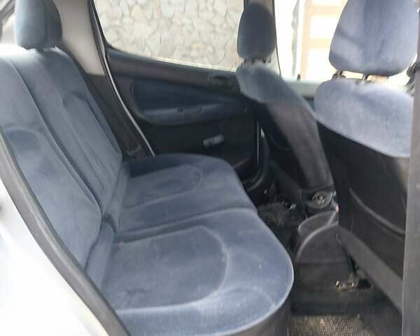 Серый Пежо 206, объемом двигателя 1.39 л и пробегом 289 тыс. км за 2550 $, фото 29 на Automoto.ua