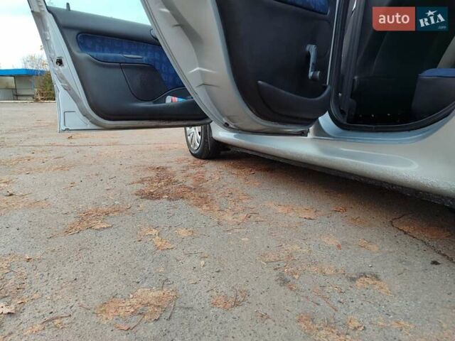 Серый Пежо 206, объемом двигателя 1.12 л и пробегом 154 тыс. км за 2900 $, фото 6 на Automoto.ua