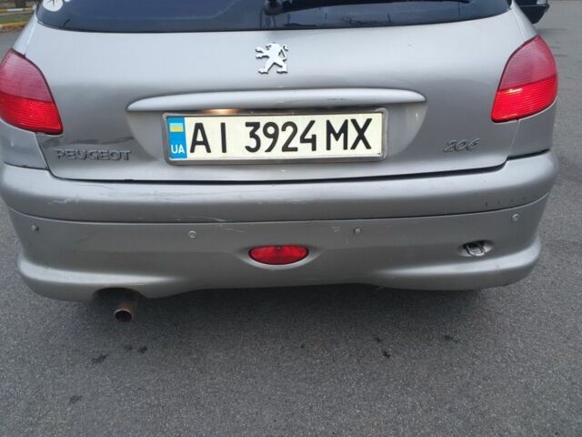 Серый Пежо 206, объемом двигателя 1.4 л и пробегом 260 тыс. км за 3000 $, фото 14 на Automoto.ua