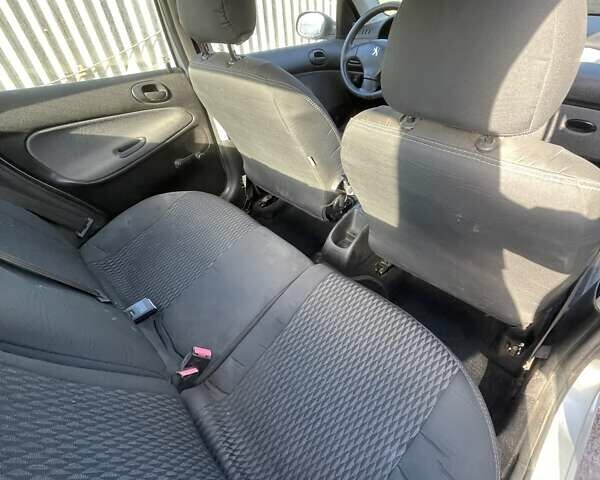 Серый Пежо 206, объемом двигателя 1.36 л и пробегом 150 тыс. км за 3500 $, фото 18 на Automoto.ua