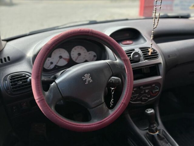 Синий Пежо 206, объемом двигателя 1.4 л и пробегом 265 тыс. км за 1999 $, фото 6 на Automoto.ua