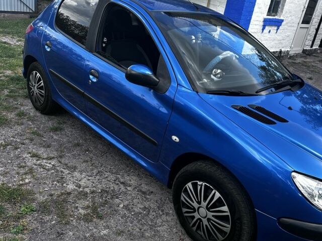 Синий Пежо 206, объемом двигателя 1.4 л и пробегом 151 тыс. км за 6400 $, фото 1 на Automoto.ua